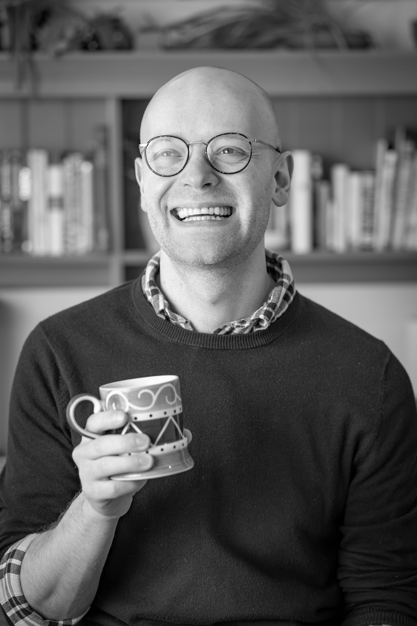 Ste Brown, smiling, in a casual headshot